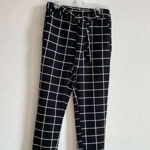 Black “Paper bag” pants slim leg.